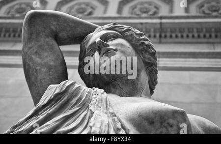 Marble statue of a wounded Amazon. Black and white shot Stock Photo