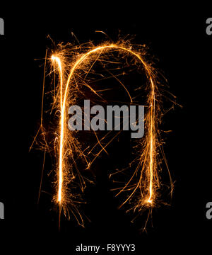 Sparkler firework light alphabet n (Small Letters) at night background Stock Photo