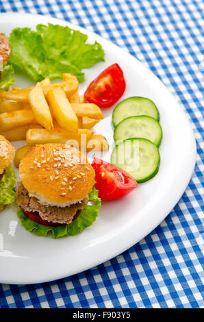 Burgers with french fries in plate Stock Photo