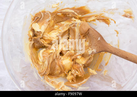https://l450v.alamy.com/450v/f9097w/combining-butter-and-smooth-peanut-butter-with-a-wooden-spoon-in-a-f9097w.jpg