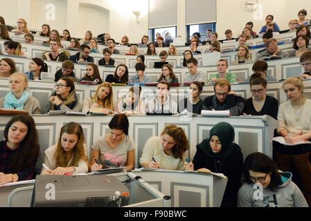 First-semester medicine and dentistry students attend a lecture on joints and muscles by Professor Heike Kielstein, head of anatomy and cell biology, in a lecture hall of the medical faculty at the Martin Luther University of Halle-Wittenberg, Germany, 01 December 2015. There are currently 2254 students at the medical faculty, studying medicine, dentistry and health and nursing studies. This winter semester's 285 new students also include 20 students who are taking part in a supplementary course in general medicine. Since 2011, this course has been offered to 20 new students, to counter the la Stock Photo