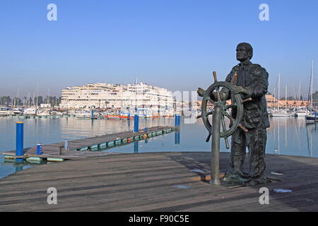 'Sailor of Vilamoura' bronze sculpture by Aden Mcleod, 2001, Vilamoura Marina, Vilamoura, Quarteira, Algarve, Portugal, Europe Stock Photo