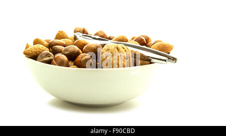 Mixed nuts in shells selection of Brazil,almonds,walnuts and hazelnuts isolated on white background Stock Photo