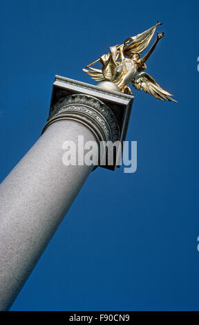 A soaring granite column topped by a gilded bronze statue of the winged figure of Victory is the First Division Monument in Washington, D.C., that honors members of 1st Infantry Division of the U.S. Army who died in World War I and following wars. The 78-foot tall memorial was dedicated in 1924 with the names of 5,516 soldiers killed in Europe between 1917-1919.  In later years, additions were made to the monument with the names of 1st Division men who lost their lives in World War II, the Vietnam War, and Desert Storm. Stock Photo