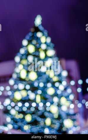 Decorated Christmas tree. Abstract blurred lights background Stock Photo