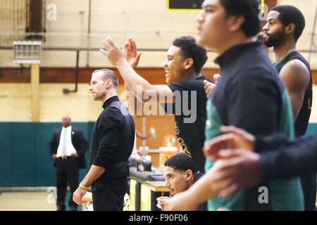 Angwin, CA, USA. 11th Dec, 2015. Pacific Union College's Head Coach Greg Rahn watches from the sideline while players cheer for their teammates from the bench during the Pioneers game against Johnson & Wales University at Pacific Union College in Angwin on Friday. © Napa Valley Register/ZUMA Wire/Alamy Live News Stock Photo