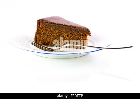The famous Sacher Cake from Vienna on a white plate Stock Photo