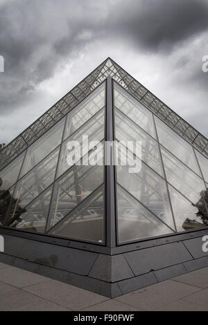 Famous Louvre Museum Pyramid made of glass in Paris, France Stock Photo