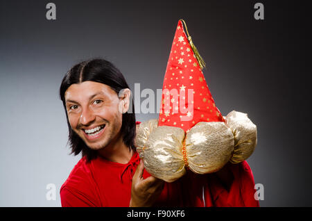 Funny wizard wearing red dress Stock Photo