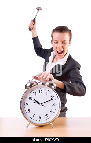 Woman desperate with time hitting clock with hammer Stock Photo