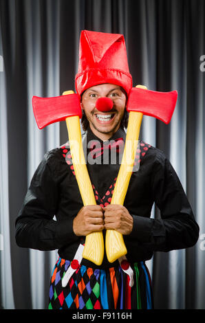 Funny clown with red axe Stock Photo