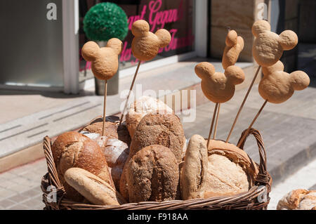 Basket of fresh bread outside bakery, Tordera, Maresme County, Province of Barcelona, Catalonia, Spain Stock Photo