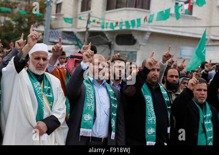 Gaza, Palestine. 11th Dec, 2015. Hamas leaders join in the Hamas anniversary celebration. Thousands of Hamas supporters in the city of Khan Younis gather to celebrate the 28th anniversary of its existence. © Ramadan El-Agha/Pacific Press/Alamy Live News Stock Photo