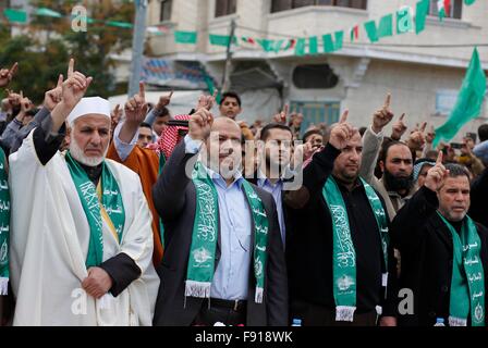 Gaza, Palestine. 11th Dec, 2015. Hamas leaders join in the Hamas anniversary celebration. Thousands of Hamas supporters in the city of Khan Younis gather to celebrate the 28th anniversary of its existence. © Ramadan El-Agha/Pacific Press/Alamy Live News Stock Photo