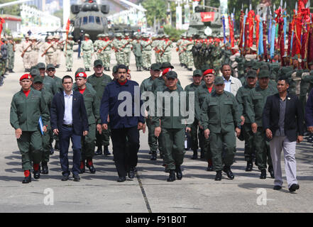 Caracas, Venezuela. 12th Dec, 2015. Photo provided by Venezuela's Presidency shows Venezuelan President Nicolas Maduro (3rd L, front) taking part in the salutation of Christmas and New Year to the elements of the National Armed Bolvarian Force (FANB, for its acronym in Spanish), in the Tiuna Fort of Caracas, capital of Venezuela, on Dec. 12, 2015. Venezuela's President Nicolas Maduro annouced on Saturday new strategic plans for the deployment of security in the border with Colombia for the first trimester of 2016. © Venezuela's Presidency/Xinhua/Alamy Live News Stock Photo