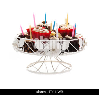 Birthday cupcakes on a stand with candles on a white background Stock Photo