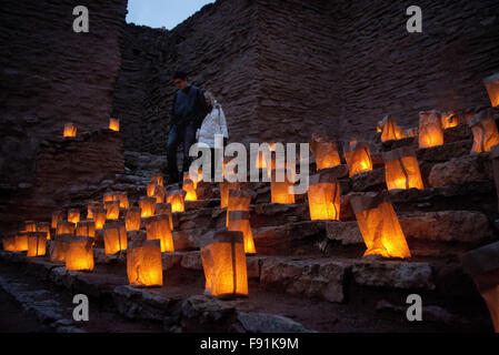 Albuquerque, New Mexico, USA. 12th Dec, 2015. 121215.Nick Bursi and his wife Alicia Bursi of Albuquerque walk through the farolitos at San Jose de los Jemez Mission Church ruins at the Jemez Historic Site during the annual Light Among the Ruins, Saturday, Dec. 12, 2015. © Marla Brose/Albuquerque Journal/ZUMA Wire/Alamy Live News Stock Photo