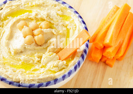 Hummus and carrot sticks Stock Photo