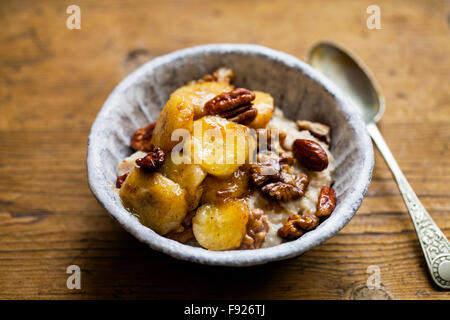 Porridge with caramelized banana and nuts Stock Photo