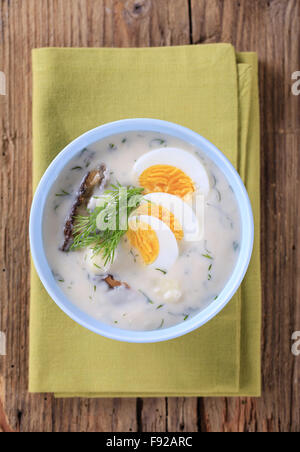 Sour cream dill soup with mushrooms and boiled egg Stock Photo