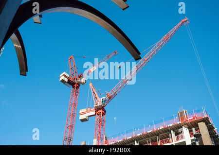 'Railway Tree' sculpture & cranes on construction site, High Street, Stratford, Greater London, England, United Kingdom