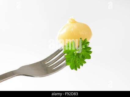 Small pickled onion on a fork Stock Photo