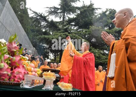 Nanjing. 13th Dec, 2015. Buddhists attend a ritual to pray for the victims at the Memorial Hall for the Victims of the Nanjing Massacre by Japanese Invaders in Nanjing, capital of east China's Jiangsu Province, on Dec. 13, 2015, China's second National Memorial Day for Nanjing Massacre Victims. About 300 Buhhhists and religious persons from China, Japan and the Republic of Korea attended the service. © Ji Chunpeng/Xinhua/Alamy Live News Stock Photo