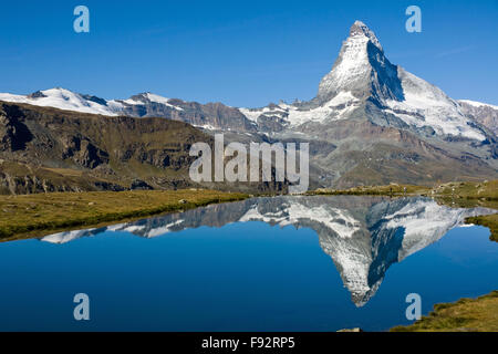The Matterhorn reflected in the Stelisee in the swiss alps Stock Photo