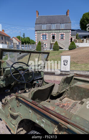 A Willys GPW Jeep parked outside the Dead Mans Corner Museum in Carentan, Normandy France Stock Photo