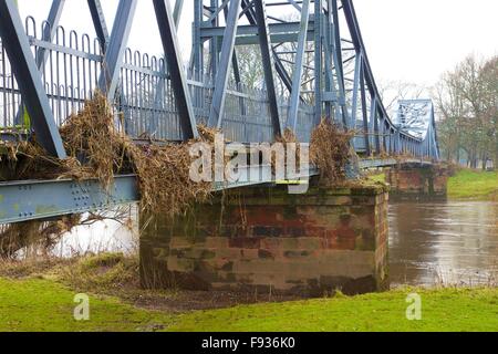 Cumbrian Floods. Carlisle, UK. 13th December 2015. Flood damaged Memorial Bridge showing height of the water by stranded flotsam. Flooding caused by Storm Desmond. Credit:  Andrew Findlay/Alamy Live News Stock Photo