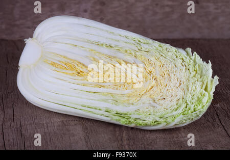 single slice of fresh chinese cabbage on a old wooden background Stock Photo