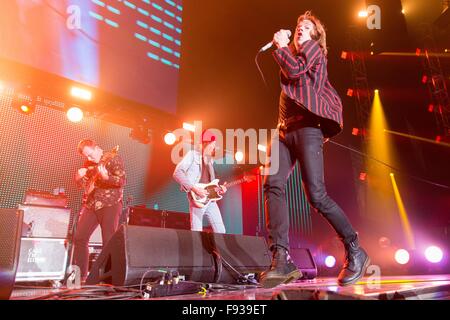 Los Angeles, California, USA. 12th Dec, 2015. BRAD SHULTZ, DANIEL TICHENOR and MATTHEW SHULTZ (L-R) of Cage The Elephant perform live during the 26th annual KROQ Almost Acoustic Christmas at The Forum in Los Angeles, California © Daniel DeSlover/ZUMA Wire/Alamy Live News Stock Photo