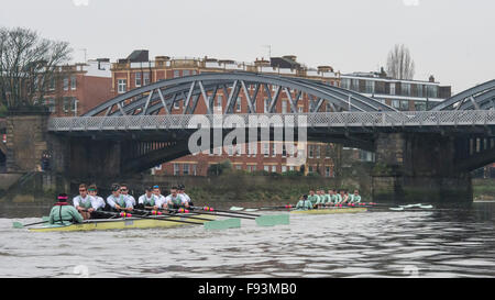 River Thames, UK. 13th December, 2015. Boat Race Trial VIIIs.  Cambridge  University Boat Club. Trial VIIIs serve as an important learning experience and selection test for the sixteen rowers and two coxes chosen. It is the only occasion during the season that the squad members race side-by-side for the entire four and a quarter miles of the Championship Course in a simulation of The BNY Mellon Boat Race. The two Cambridge crews taking to the water have been named ‘”Fuerte” and “Listo”. Credit:  Duncan Grove/Alamy Live News Stock Photo