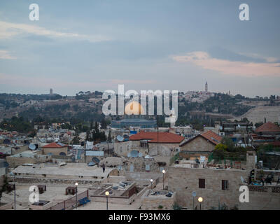 View to the Dome of The Rock over Old Jerusalem roofs at dusk Stock Photo