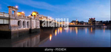 A panorama of Rochester Castle, Cathedral and Bridge, illuminated at dusk. Stock Photo