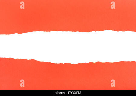 divided halves of the sheet of red ripped paper on white background Stock Photo