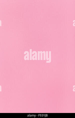 vertical background from pink colored sheet of paper Stock Photo