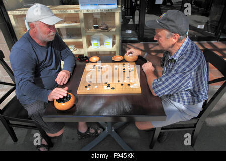 People playing go, strategic board game, Stock Photo