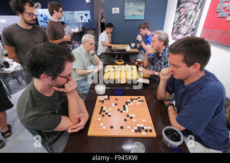 People playing go, strategic board game, Stock Photo