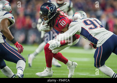 Houston, Texas, USA. 13th Dec, 2015. Houston Texans wide receiver DeAndre Hopkins (10) gets tackled by New England Patriots outside linebacker Jamie Collins (91) after making a catch during the 3rd quarter of an NFL game between the Houston Texans and the New England Patriots at NRG Stadium in Houston, TX on December 13th, 2015. Credit:  Trask Smith/ZUMA Wire/Alamy Live News Stock Photo