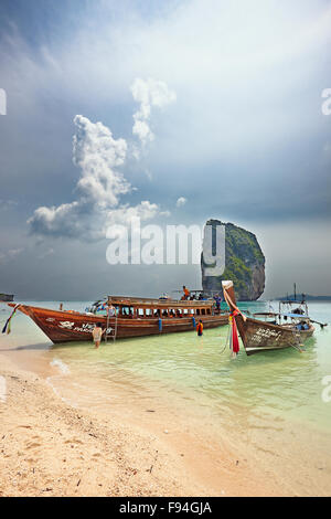 Traditional long-tail boats moored at the beach on Poda Island (Koh Poda). Krabi Province, Thailand.