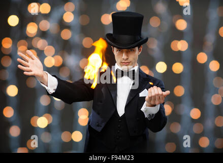 magician in top hat showing trick Stock Photo