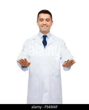 smiling male doctor touching something Stock Photo
