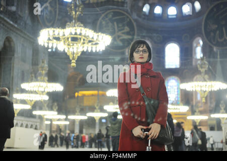 happy young tourist woman travel visit ancient istambul in turkey and old ayasofya blue mosque Stock Photo