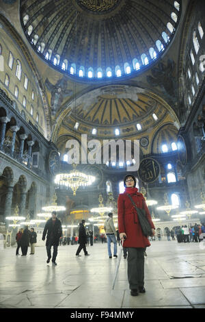 happy young tourist woman travel visit ancient istambul in turkey and old ayasofya blue mosque Stock Photo