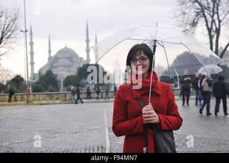 happy young tourist woman travel visit ancient istambul in turkey and old ayasofya blue mosque Stock Photo