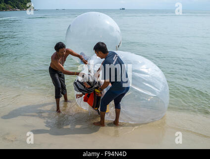 Muslim Tourist Inside A Water Walking Ball On Monkey Beach In Nan National Park, Penang Island, George Town, Malaysia Stock Photo