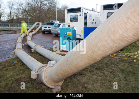 Environment Agency staff Pumping out floodwater from Hardwicke Circus in Carlisle, Cumbria on Tuesday 8th December 2015, after torrential rain from storm Desmond. The storm set a new British record for rainfall totals in a day with 341.4mm falling in 24 hours. Stock Photo