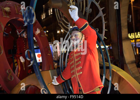 Brussels, Belgium. 13th Dec, 2015. Actor in costume of clock hour hand greets people during Christmas RTL Parade on 13 December, 2015 in Brussels, Belgium Credit:  Skyfish/Alamy Live News Stock Photo