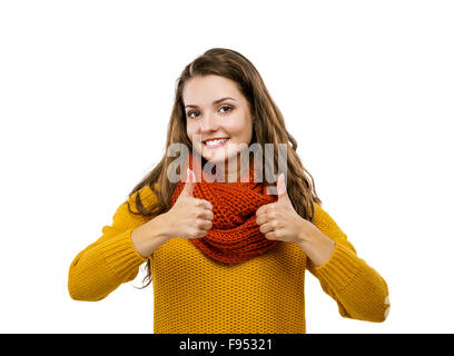 Portrait of beautiful girl in autumn clothes with thumbs up, isolated on white background Stock Photo